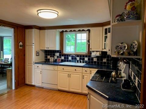 22 Fairview Avenue Madison, CT 06443 - Photo 15 of 31 a kitchen with stainless steel appliances granite countertop a sink stove and cabinets