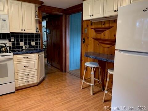 22 Fairview Avenue Madison, CT 06443 - Photo 16 of 31 a view of kitchen with wooden floor and cabinets
