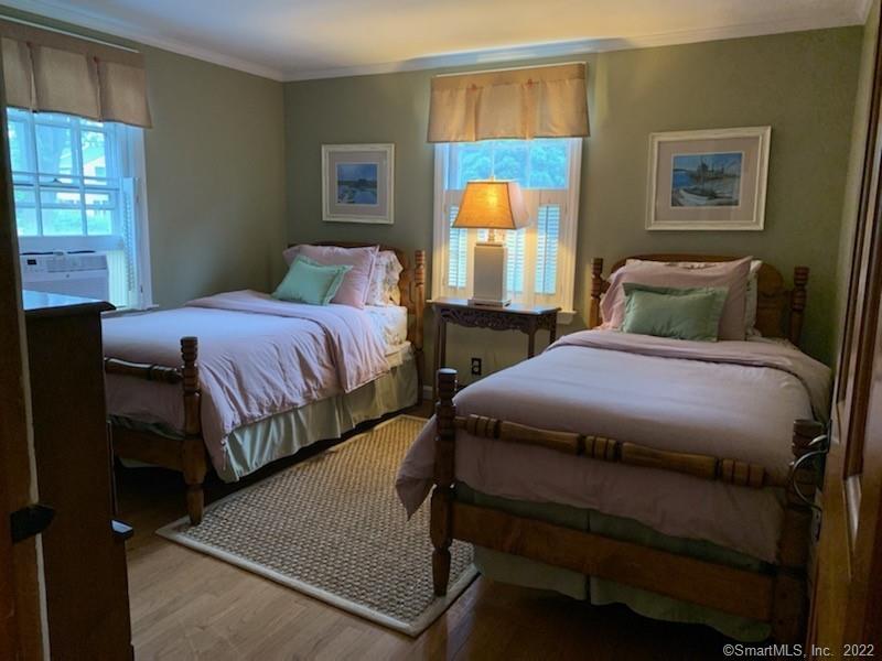 22 Fairview Avenue Madison, CT 06443 - Photo 21 of 31 a bedroom with a bed and window