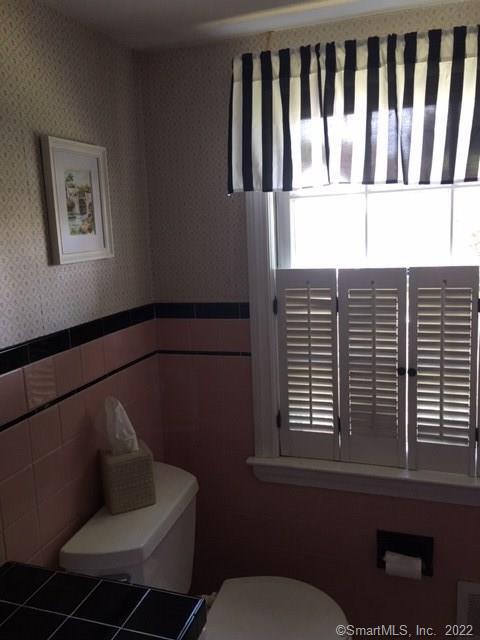 22 Fairview Avenue Madison, CT 06443 - Photo 27 of 31 a bathroom with a toilet and a window