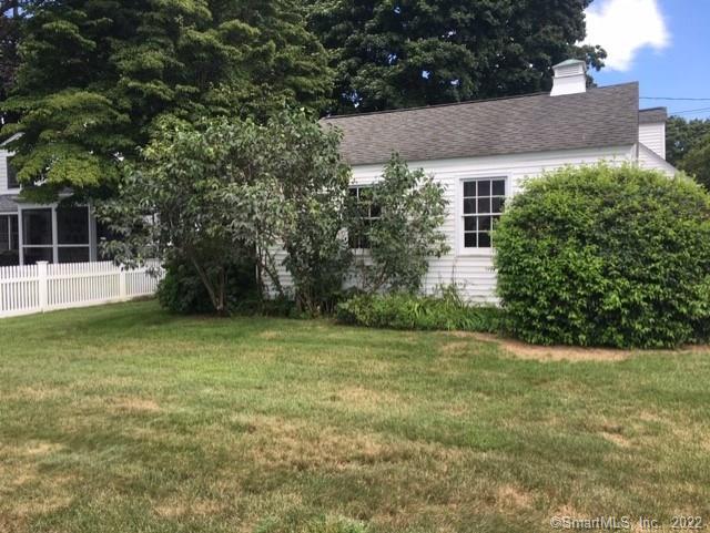 22 Fairview Avenue Madison, CT 06443 - Photo 31 of 31 a view of a house with a yard and a tree