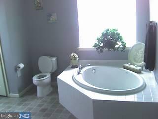154 Quiet Road Sicklerville, NJ 08081 - Photo 5 of 6 a white tub sitting next to a white toilet