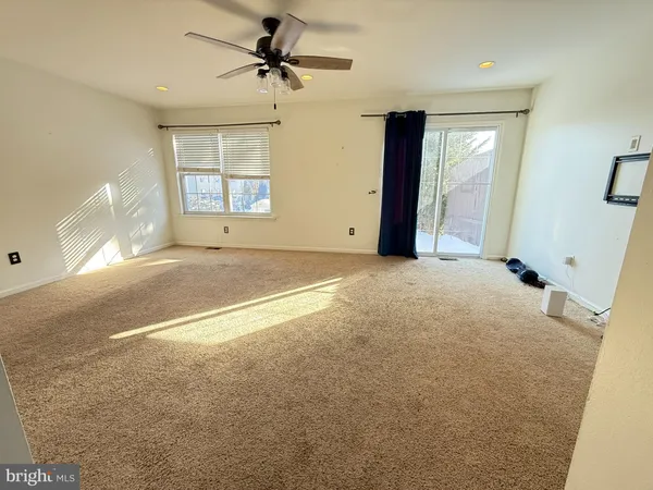 a view of empty room with windows