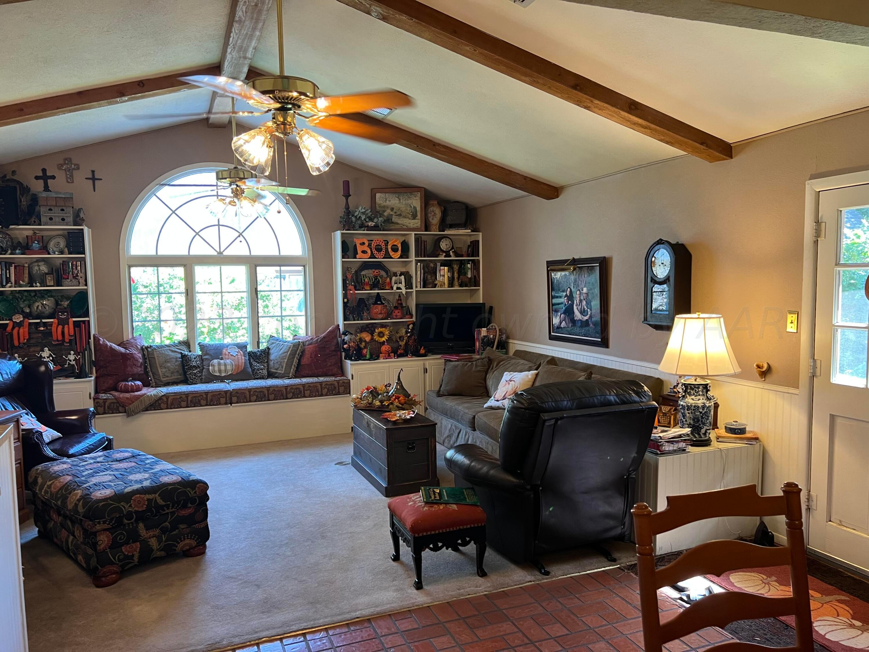 1505 Pellinore Street Borger, TX 79007 - Photo 12 of 73 a living room with furniture fireplace and a large window