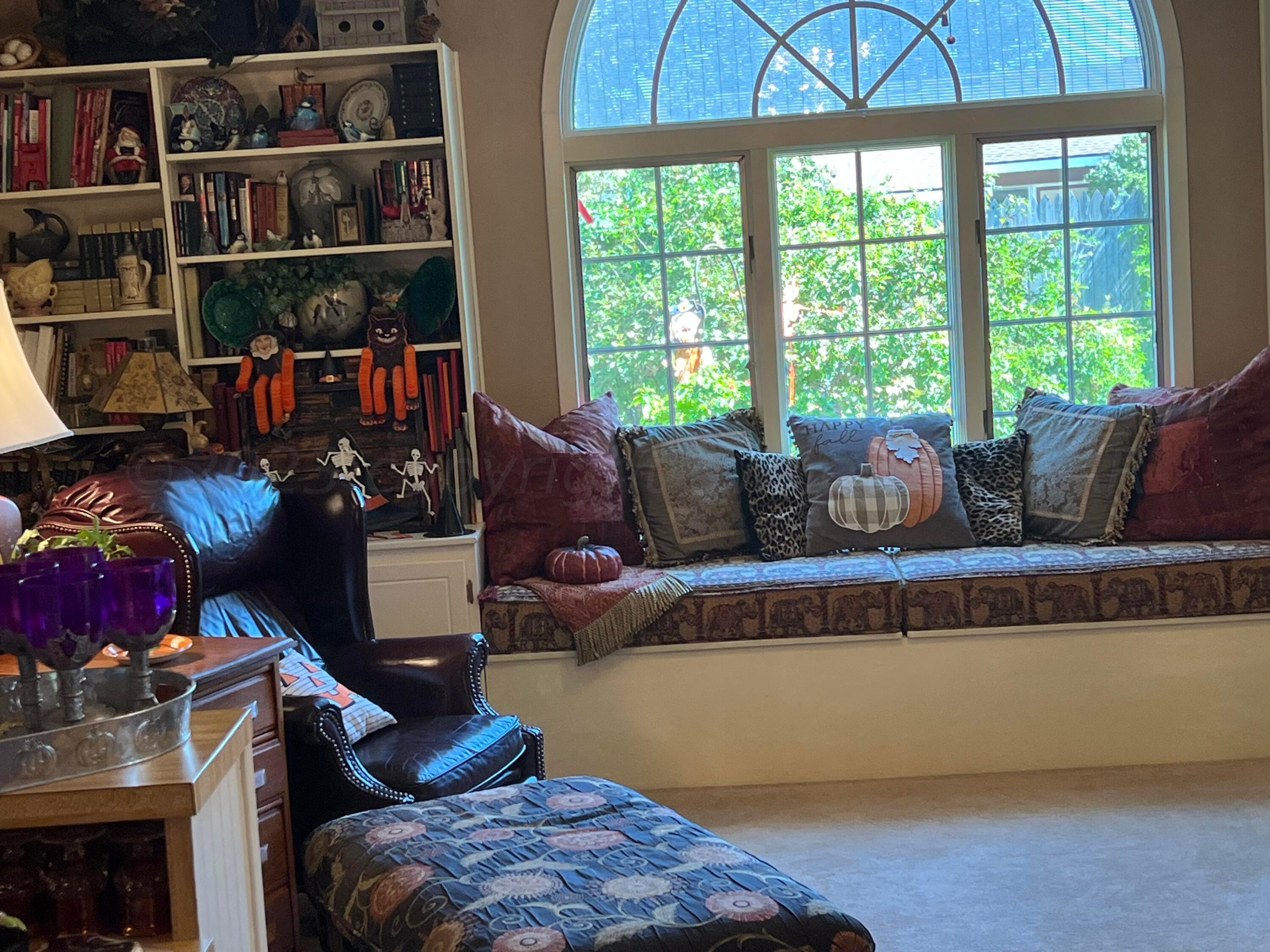 1505 Pellinore Street Borger, TX 79007 - Photo 26 of 73 a living room with furniture and a floor to ceiling window