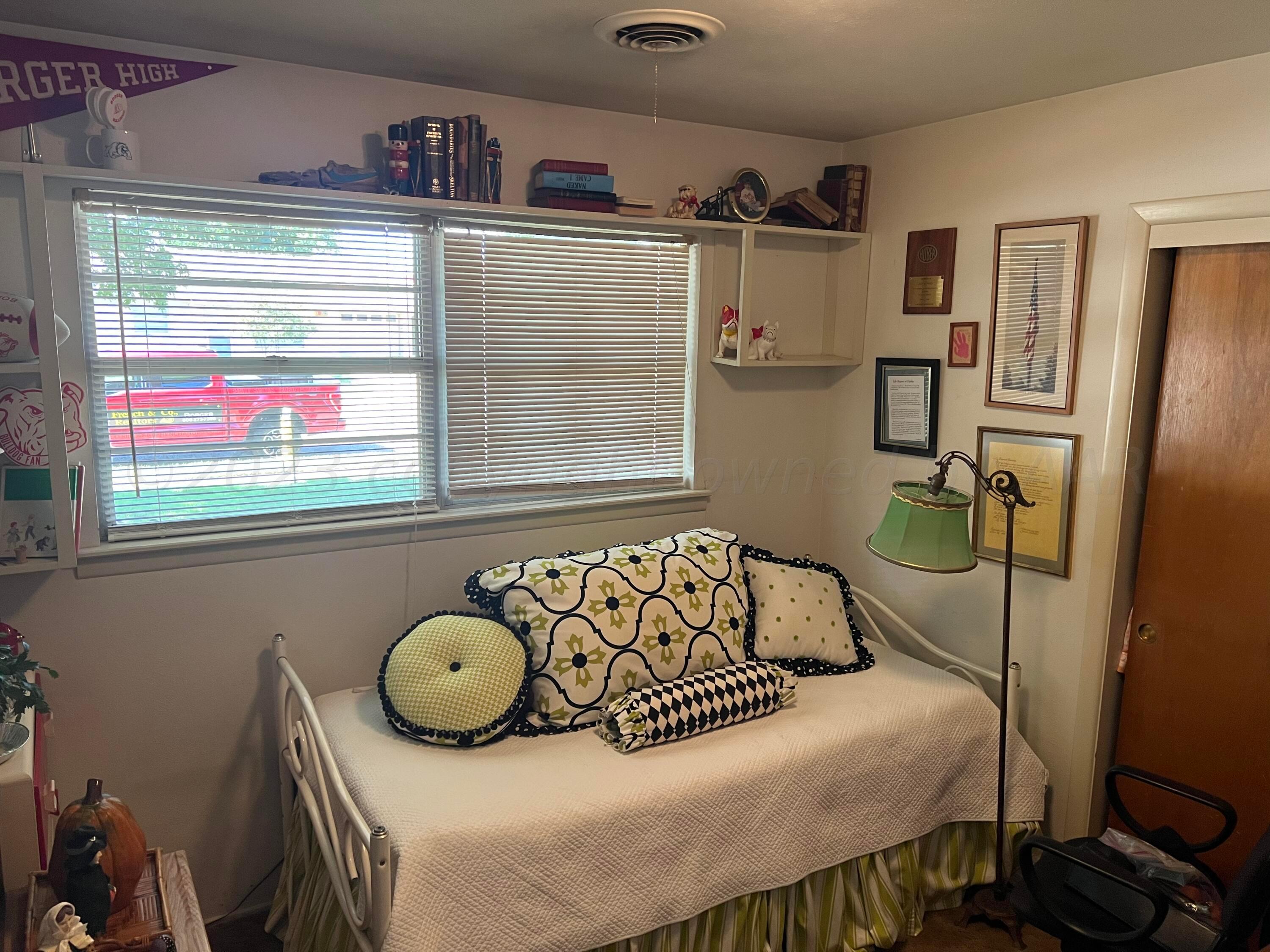 1505 Pellinore Street Borger, TX 79007 - Photo 28 of 73 a bedroom with a bed and a window