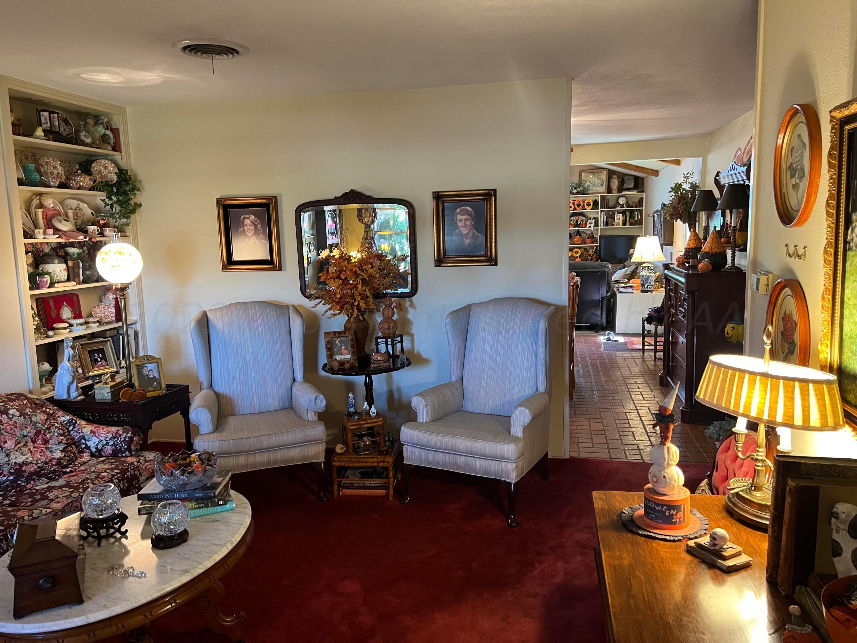 1505 Pellinore Street Borger, TX 79007 - Photo 3 of 73 a living room with furniture couches and a flat screen tv