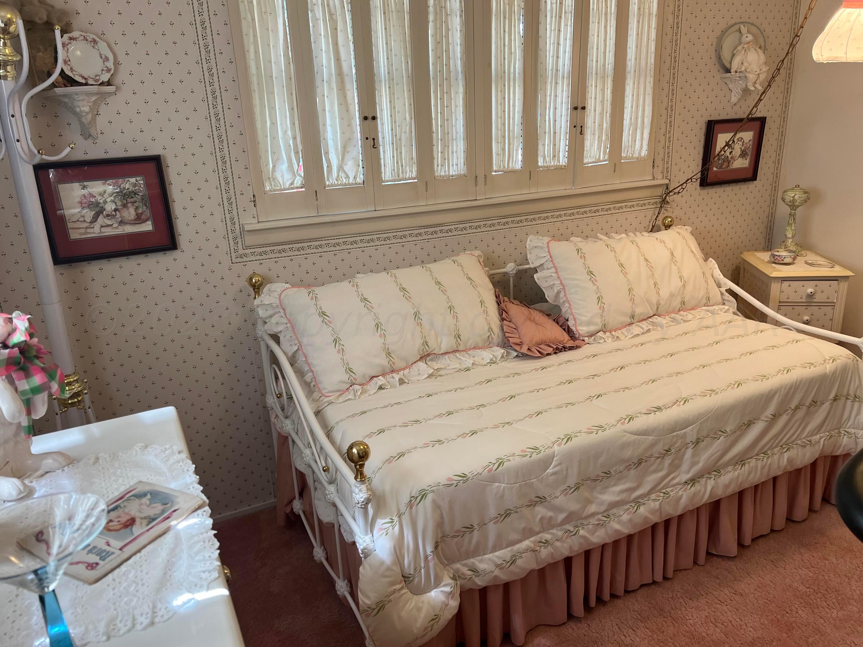 1505 Pellinore Street Borger, TX 79007 - Photo 32 of 73 a bedroom with a bed with wooden floor