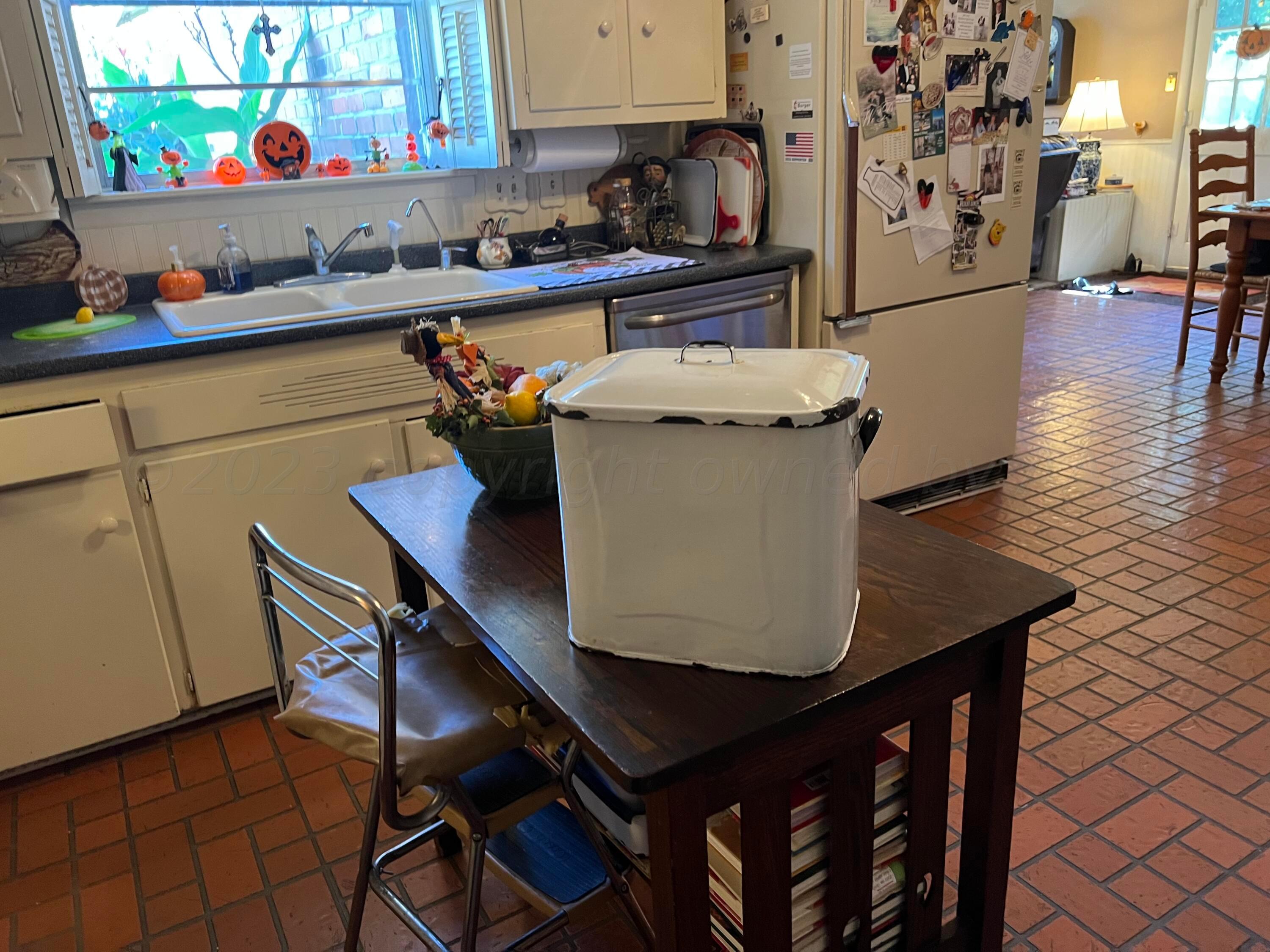 1505 Pellinore Street Borger, TX 79007 - Photo 51 of 73 a room with stainless steel appliances kitchen island granite countertop furniture a refrigerator and a sink