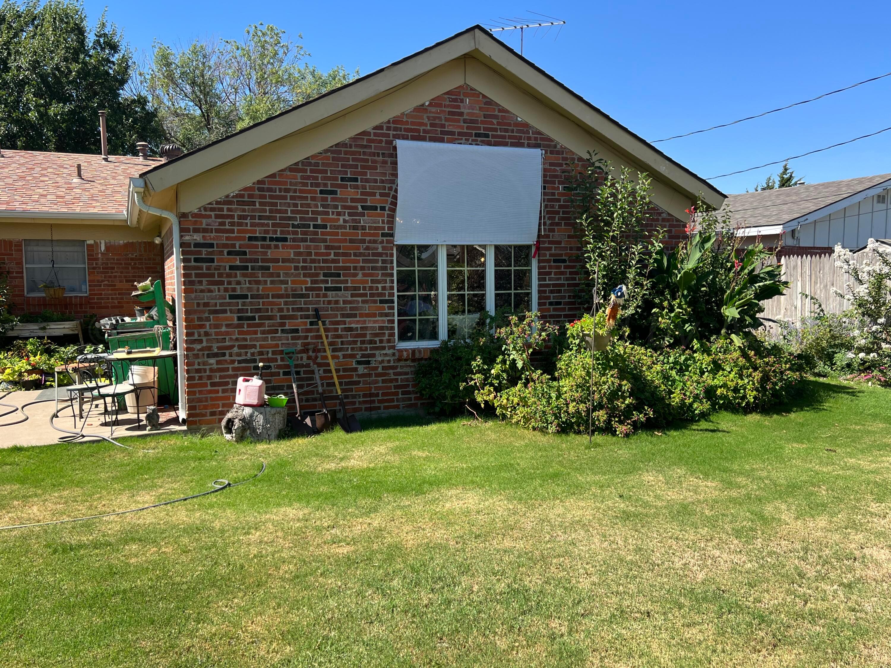 1505 Pellinore Street Borger, TX 79007 - Photo 62 of 73 a front view of a house with garden