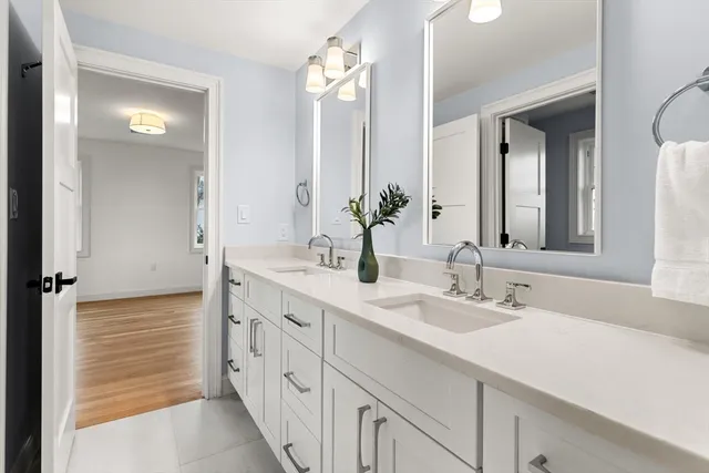a bath tub sitting next to a white toilet