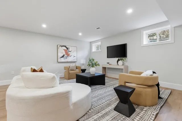 a living room with furniture and a glass table