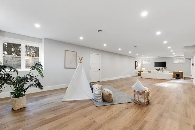a bathroom with a double vanity sink toilet mirror and shower