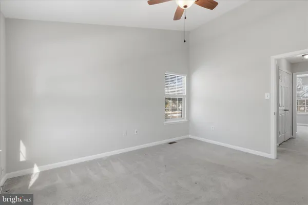 a bathroom with a sink toilet vanity and tub