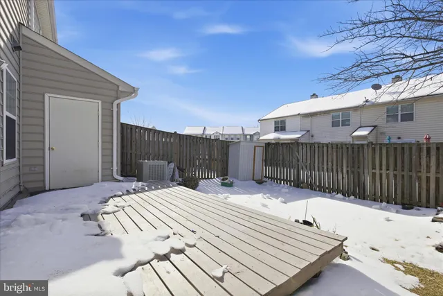 a building outdoor space with patio furniture and potted plants