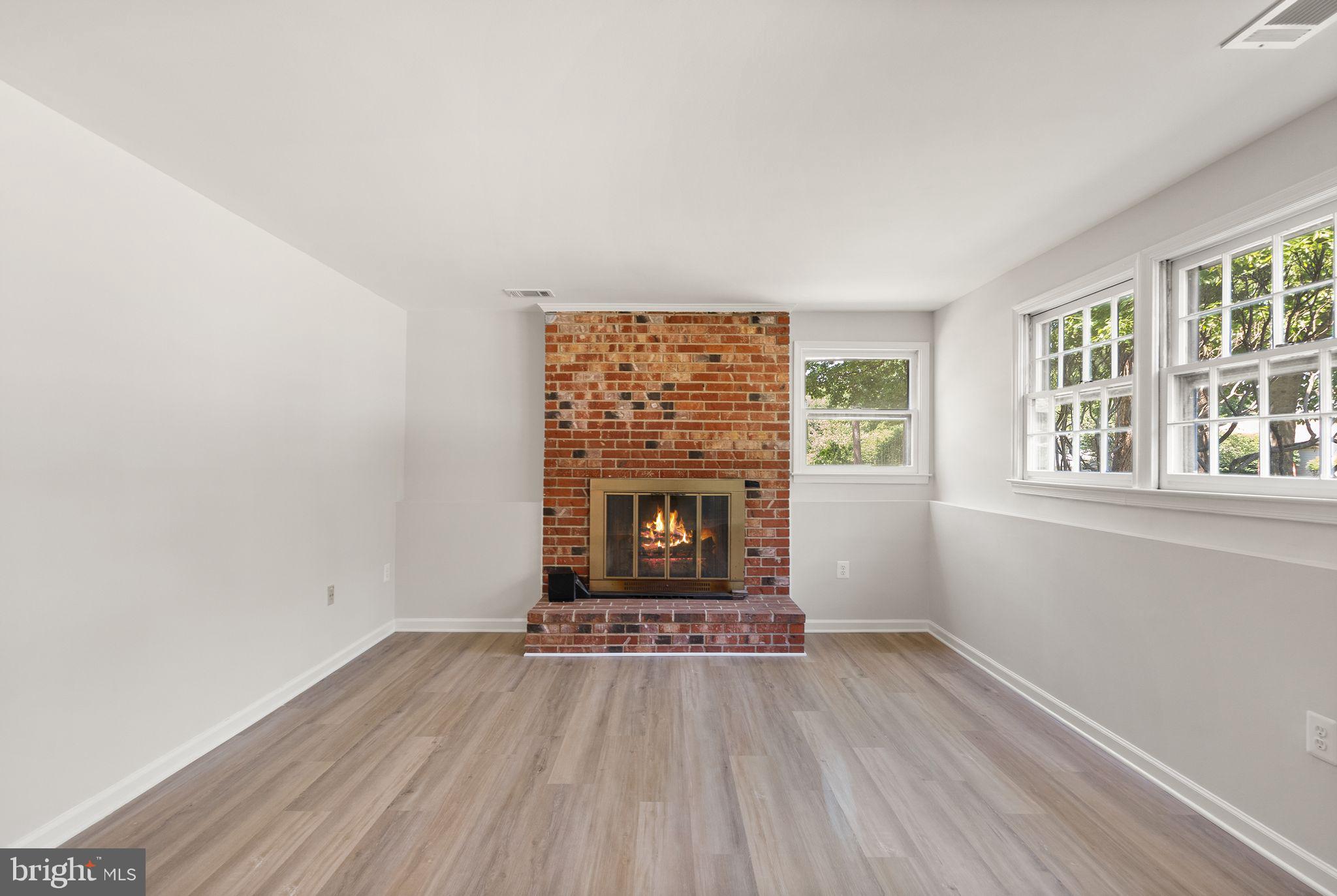 8803 Hayload Court Springfield, VA 22153 - Photo 32 of 49 Basement Rec Room w/ Wood Burning Fireplace