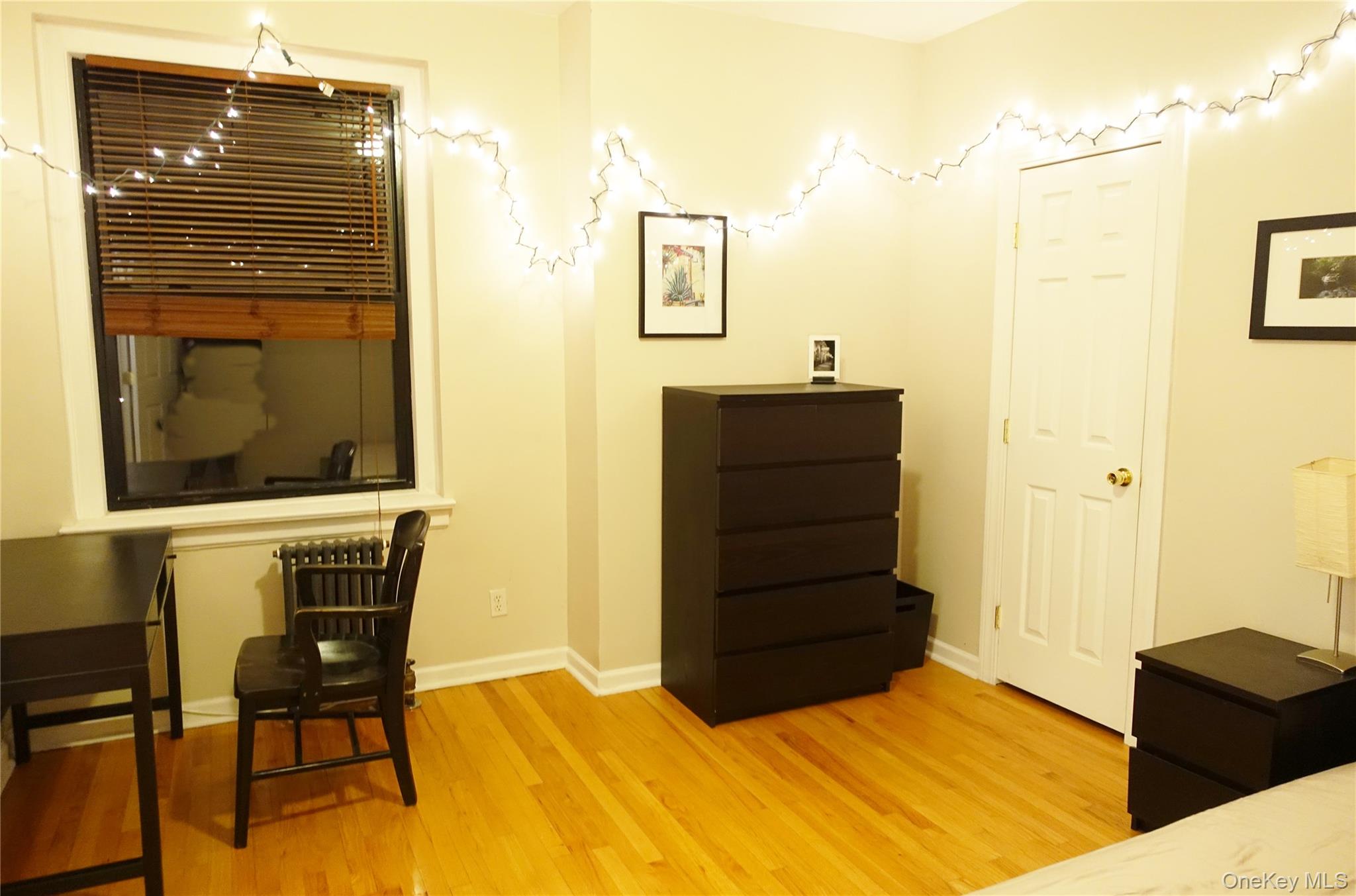 62-64 Saunders Street, Unit 4P Queens, NY 11374 - Photo 8 of 9 a bedroom with a bed and cabinets