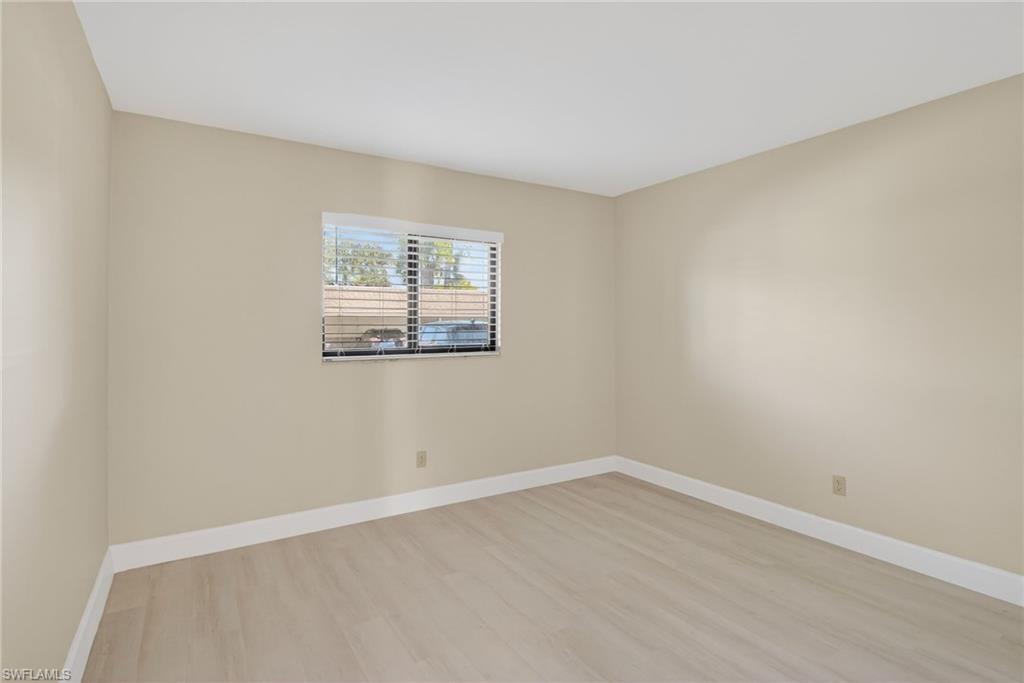 5773 Gage Lane, Unit B101 Naples, FL 34113 - Photo 11 of 39 an empty room with a window