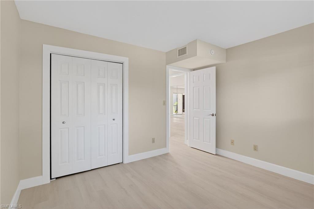 5773 Gage Lane, Unit B101 Naples, FL 34113 - Photo 13 of 39 a view of an empty room and closet area