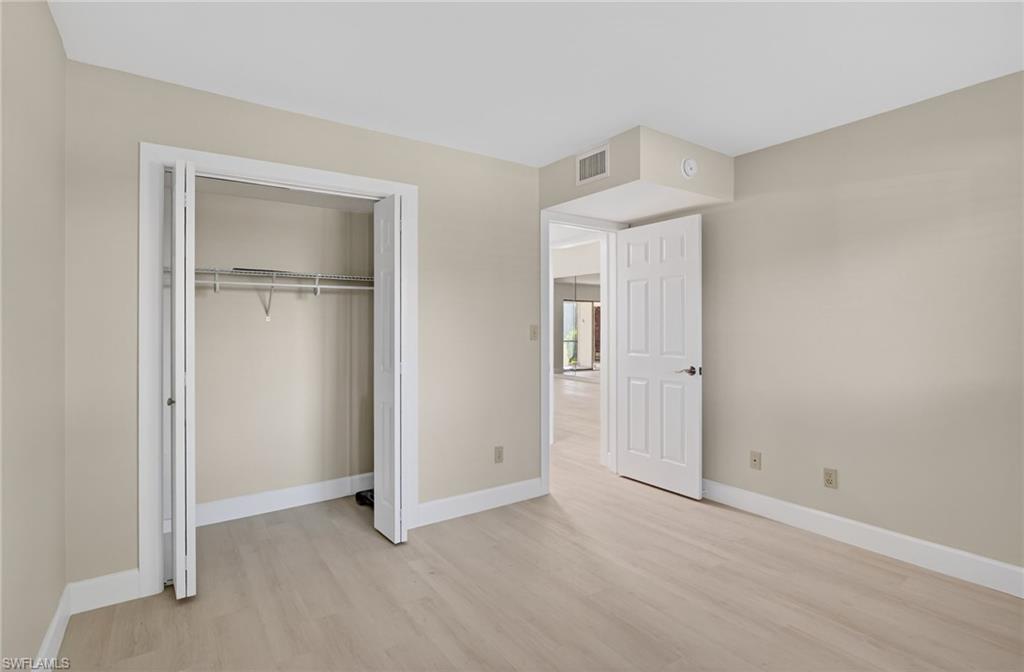 5773 Gage Lane, Unit B101 Naples, FL 34113 - Photo 14 of 39 a view of an empty room with closet area