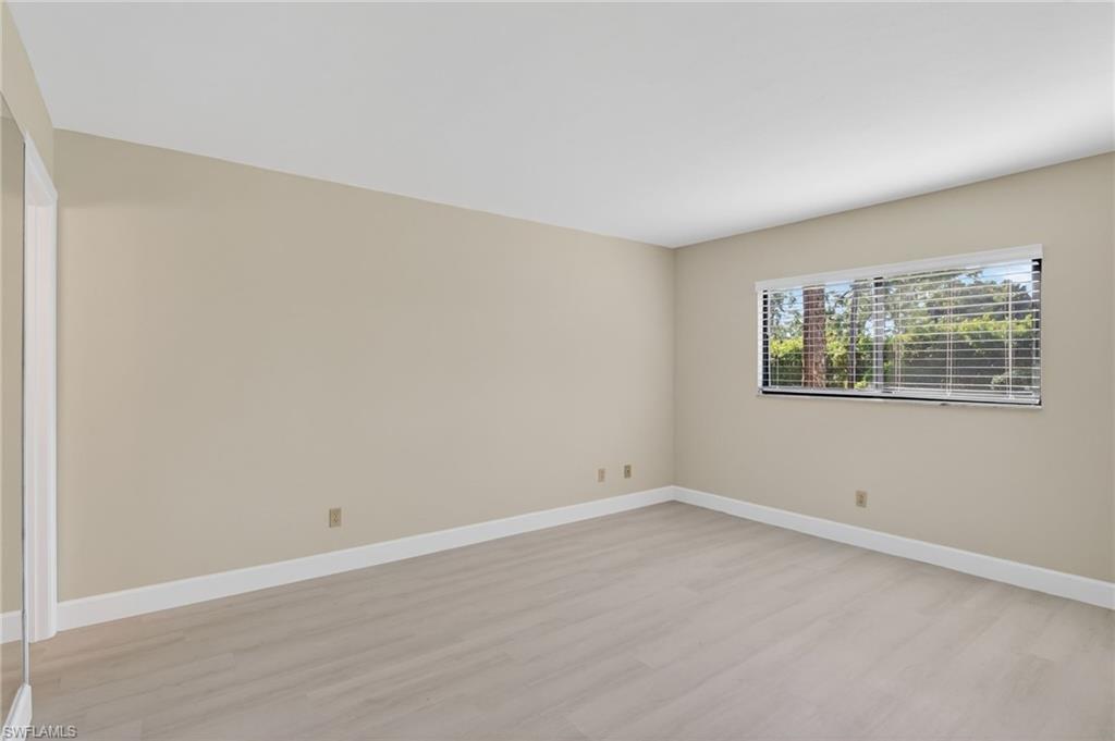 5773 Gage Lane, Unit B101 Naples, FL 34113 - Photo 19 of 39 an empty room with a window