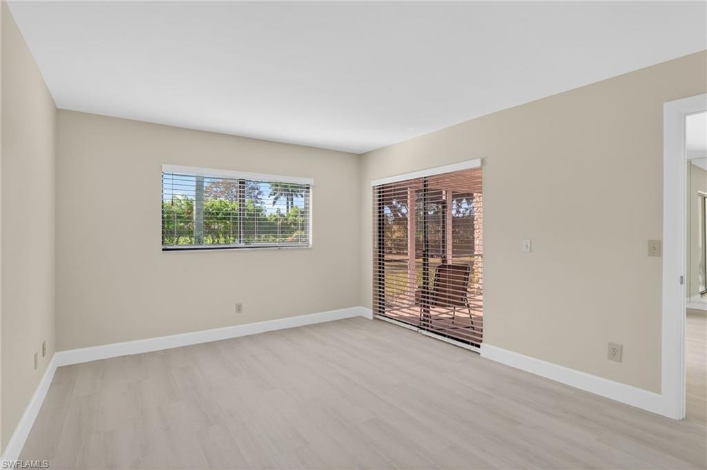 5773 Gage Lane, Unit B101 Naples, FL 34113 - Photo 20 of 39 an empty room with windows