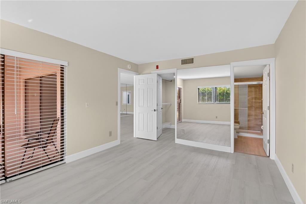 5773 Gage Lane, Unit B101 Naples, FL 34113 - Photo 21 of 39 a view of an empty room with a window