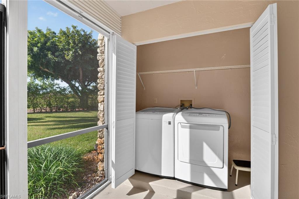 5773 Gage Lane, Unit B101 Naples, FL 34113 - Photo 23 of 39 a utility room with dryer and washer