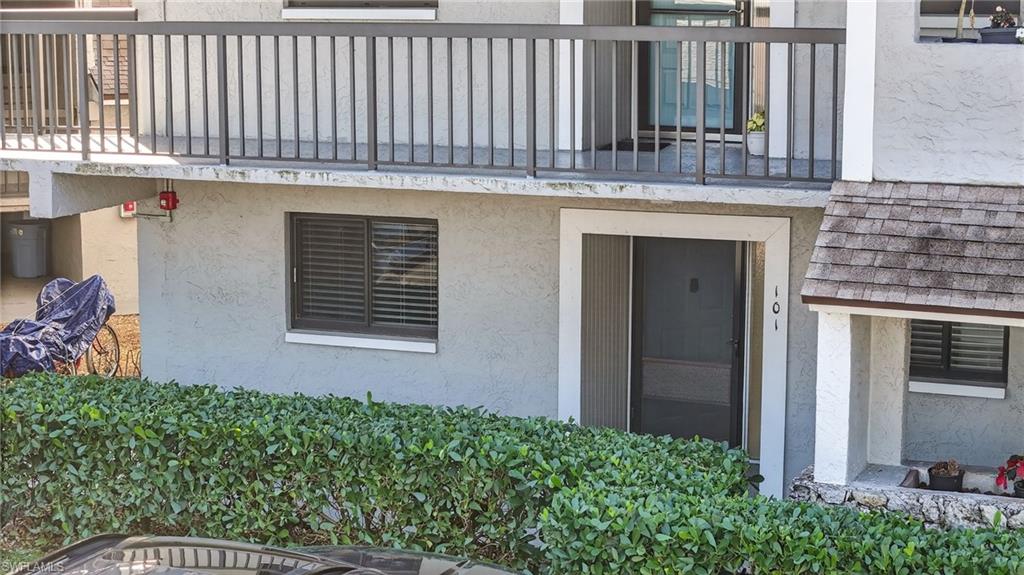 5773 Gage Lane, Unit B101 Naples, FL 34113 - Photo 25 of 39 a house view with a garden space