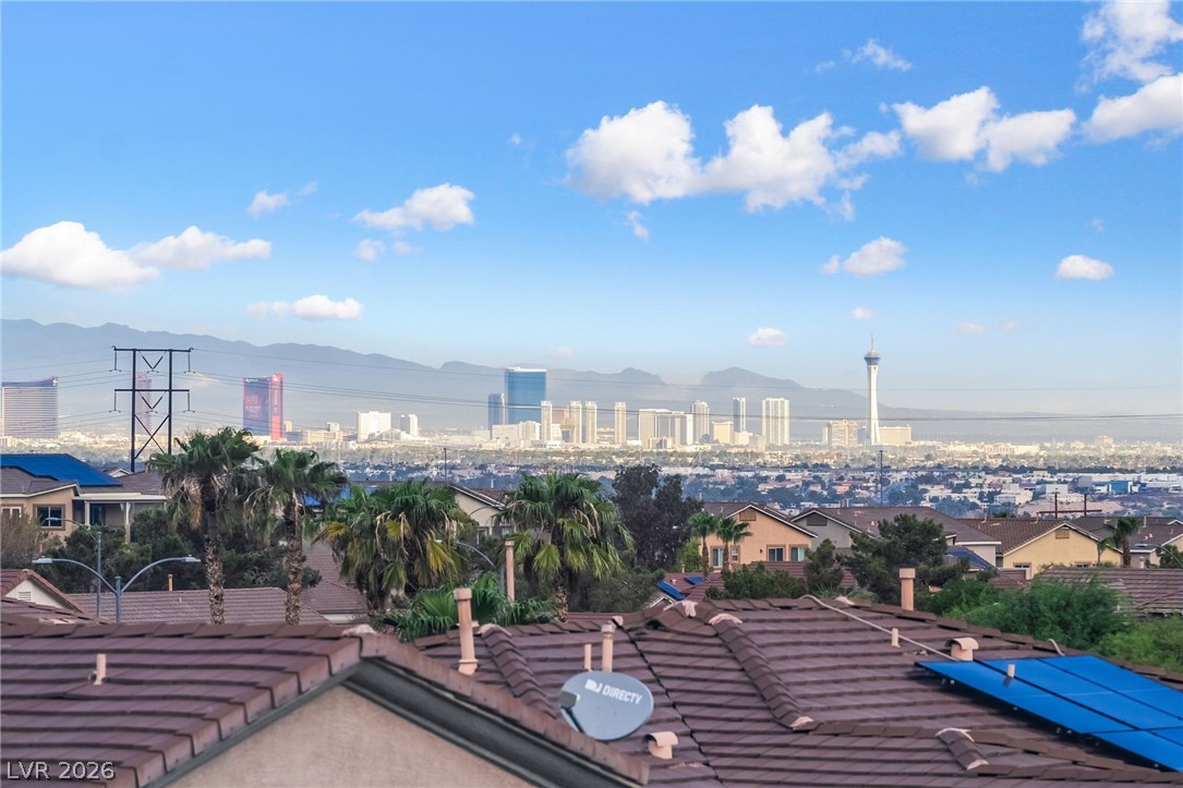 224 Positive Point Street Henderson, NV 89012 - Photo 38 of 44 Panoramic mountain and skyline views overlook the surrounding neighborhood under clear blue skies.