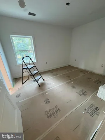 a view of living room with furniture and rug