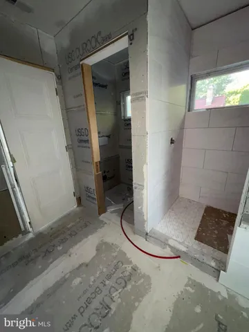 a view of front door of house with a window