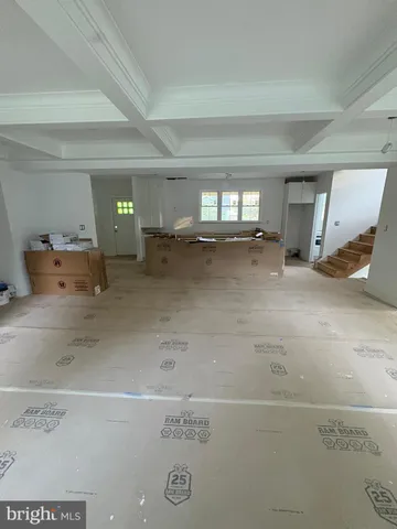 a kitchen with a stove and white cabinets
