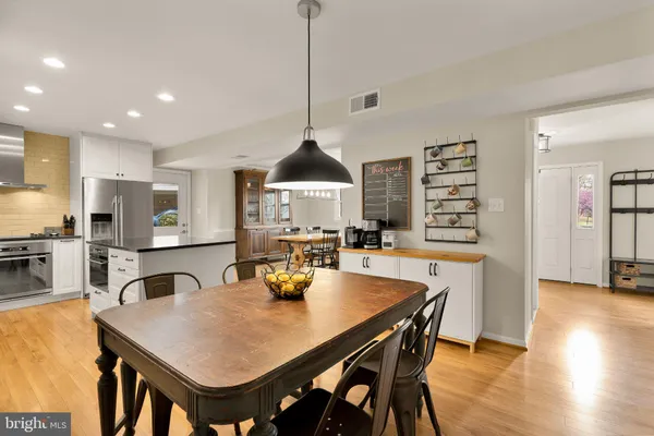a dining room with furniture and window