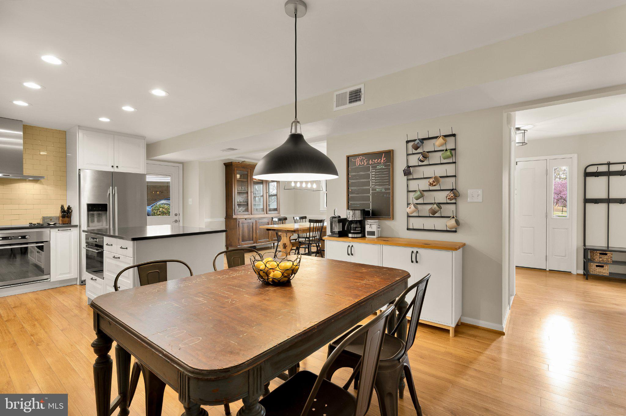6800 Riata Court Springfield, VA 22153 - Photo 13 of 37 Modern kitchen with warm wood accents.
