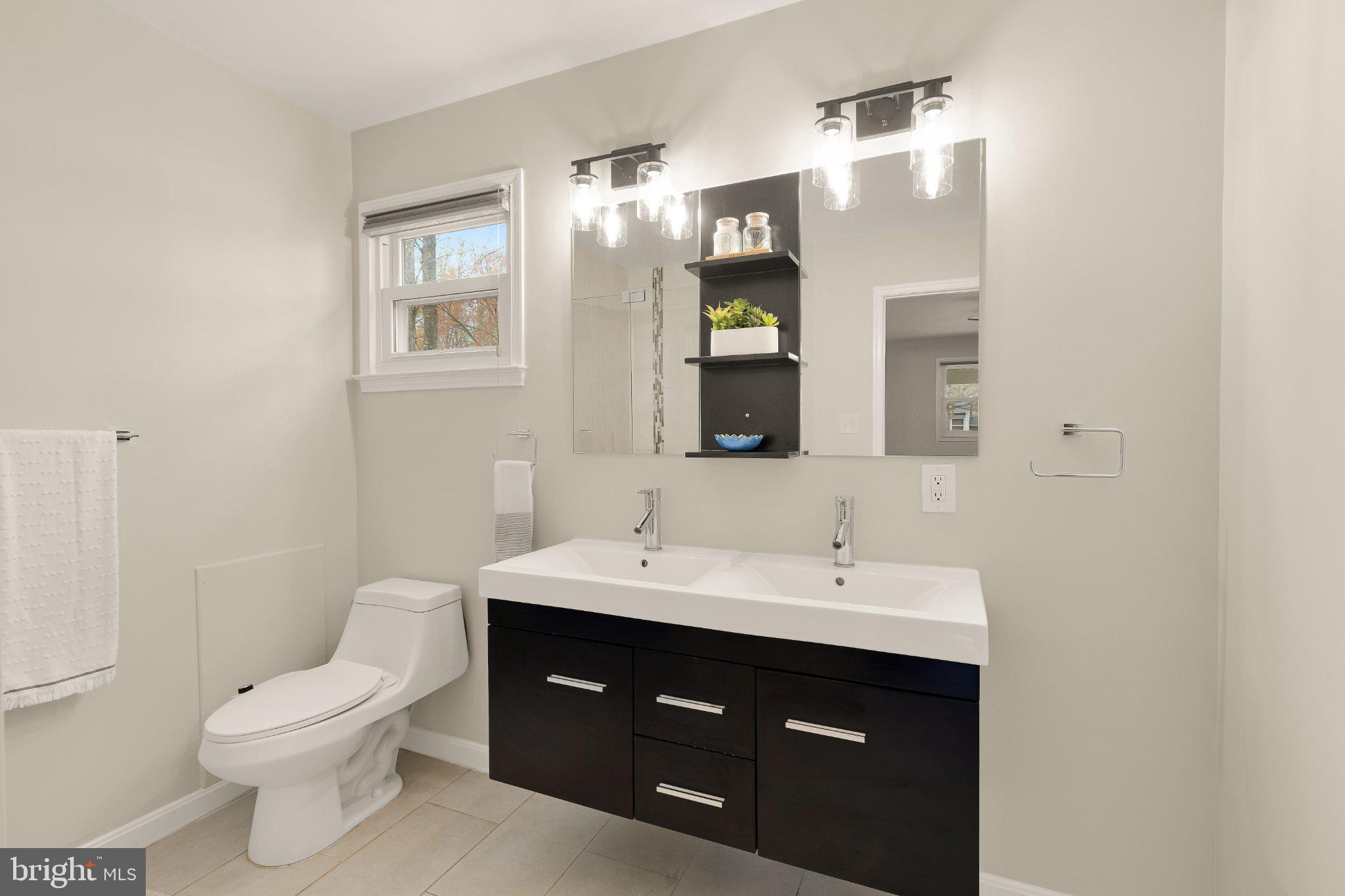 6800 Riata Court Springfield, VA 22153 - Photo 18 of 37 Modern elegance in a serene bathroom.