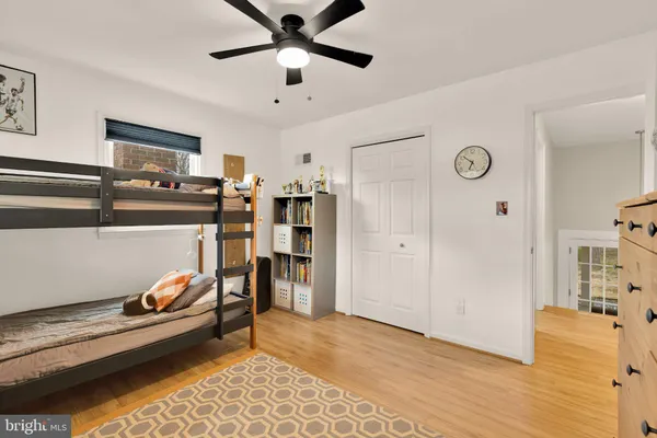 a bedroom with furniture and window