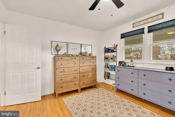 a room with a dresser and a chair