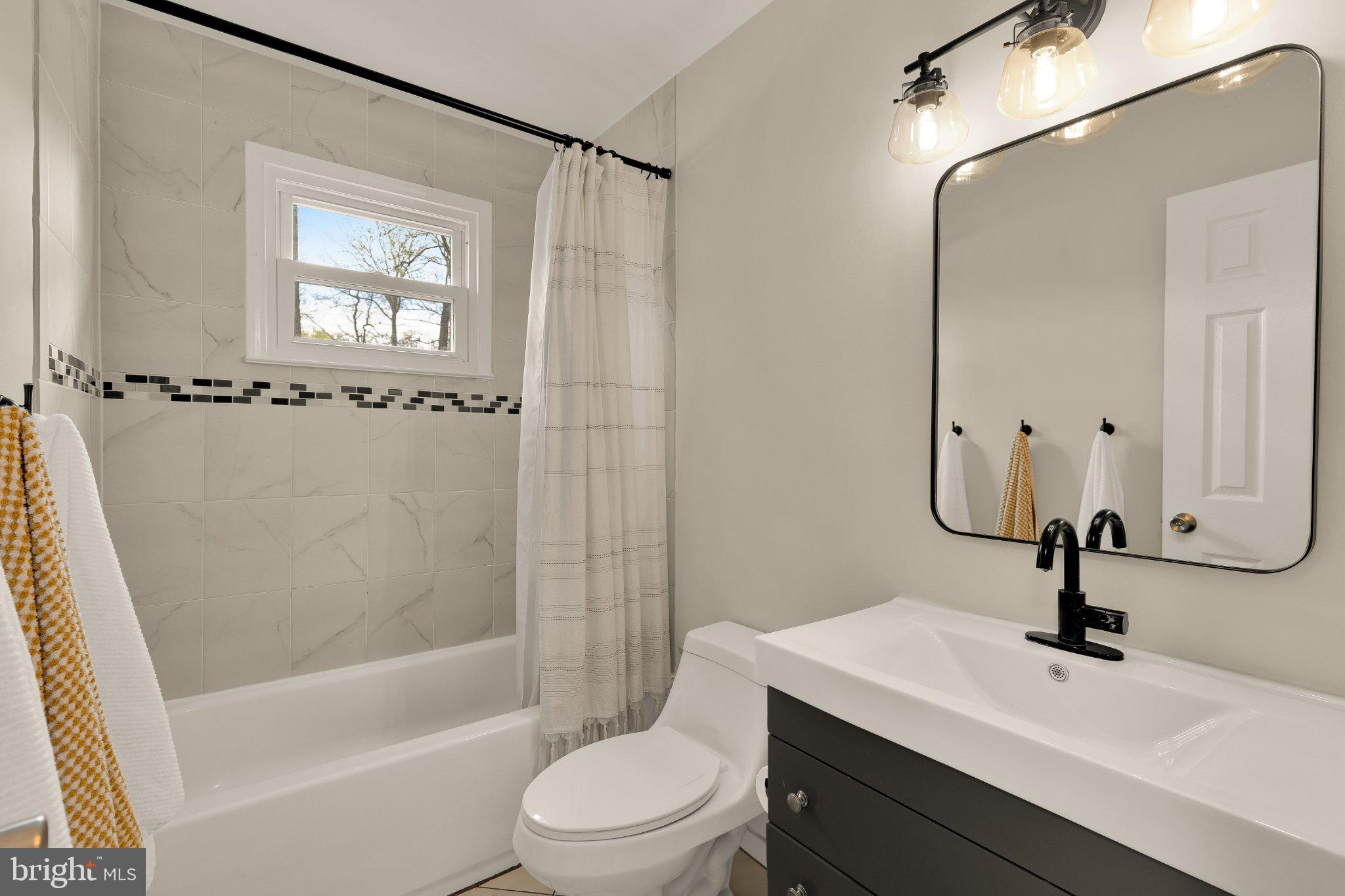 6800 Riata Court Springfield, VA 22153 - Photo 27 of 37 Modern bathroom with stylish fixtures.