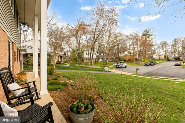 a view of a garden with sitting area