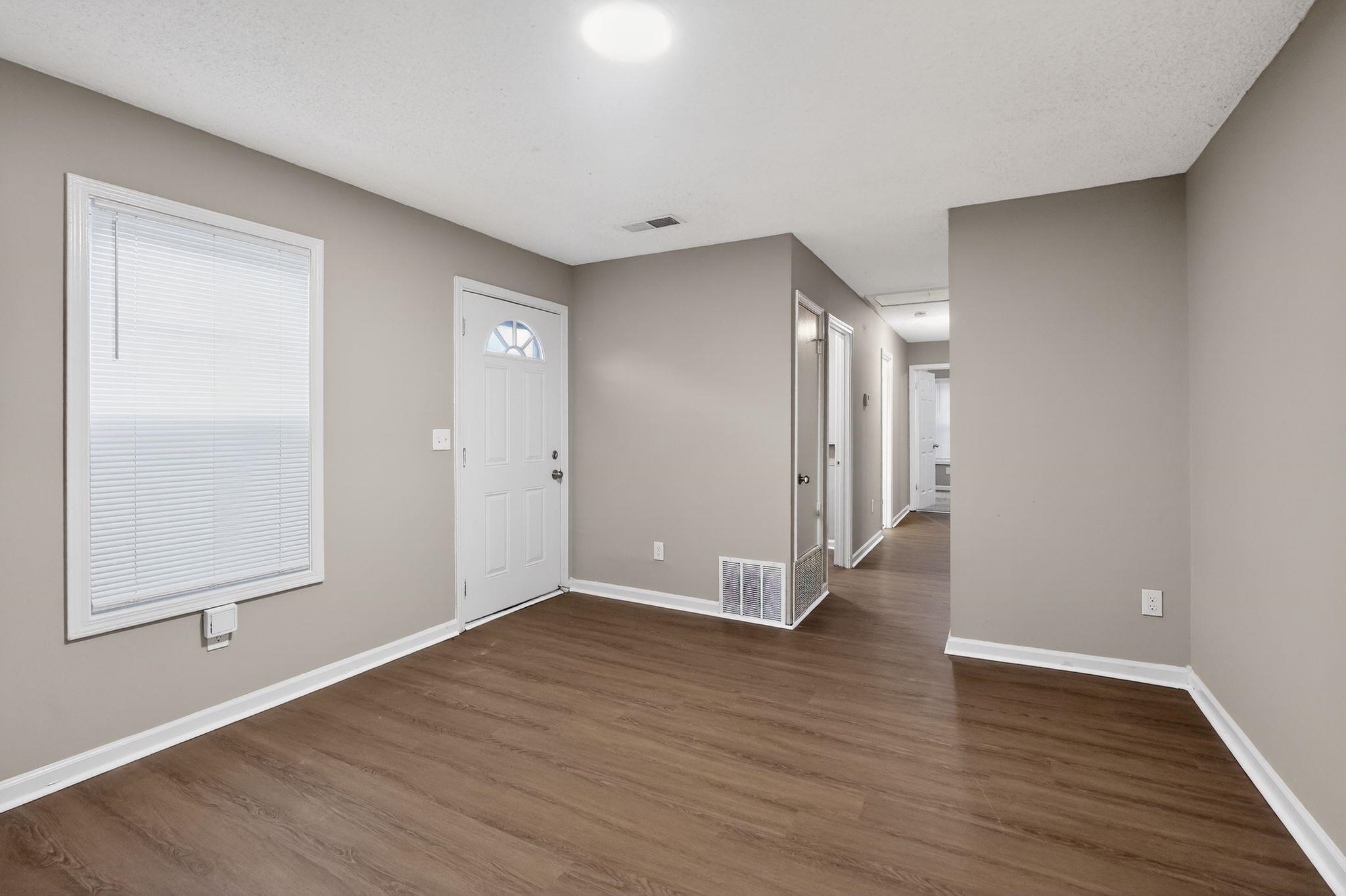 4725 Lofts Road Memphis, TN 38118 - Photo 7 of 32 Foyer entrance featuring dark wood-style floors