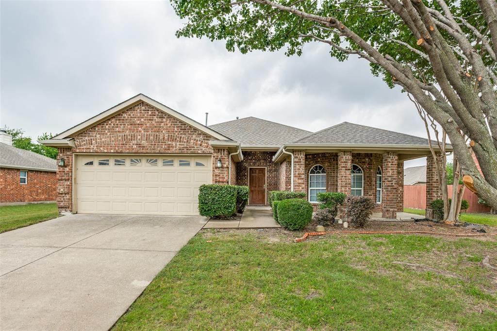 11841 Chaparral Drive Frisco, TX 75035 - Photo 1 of 1 a front view of a house with garden