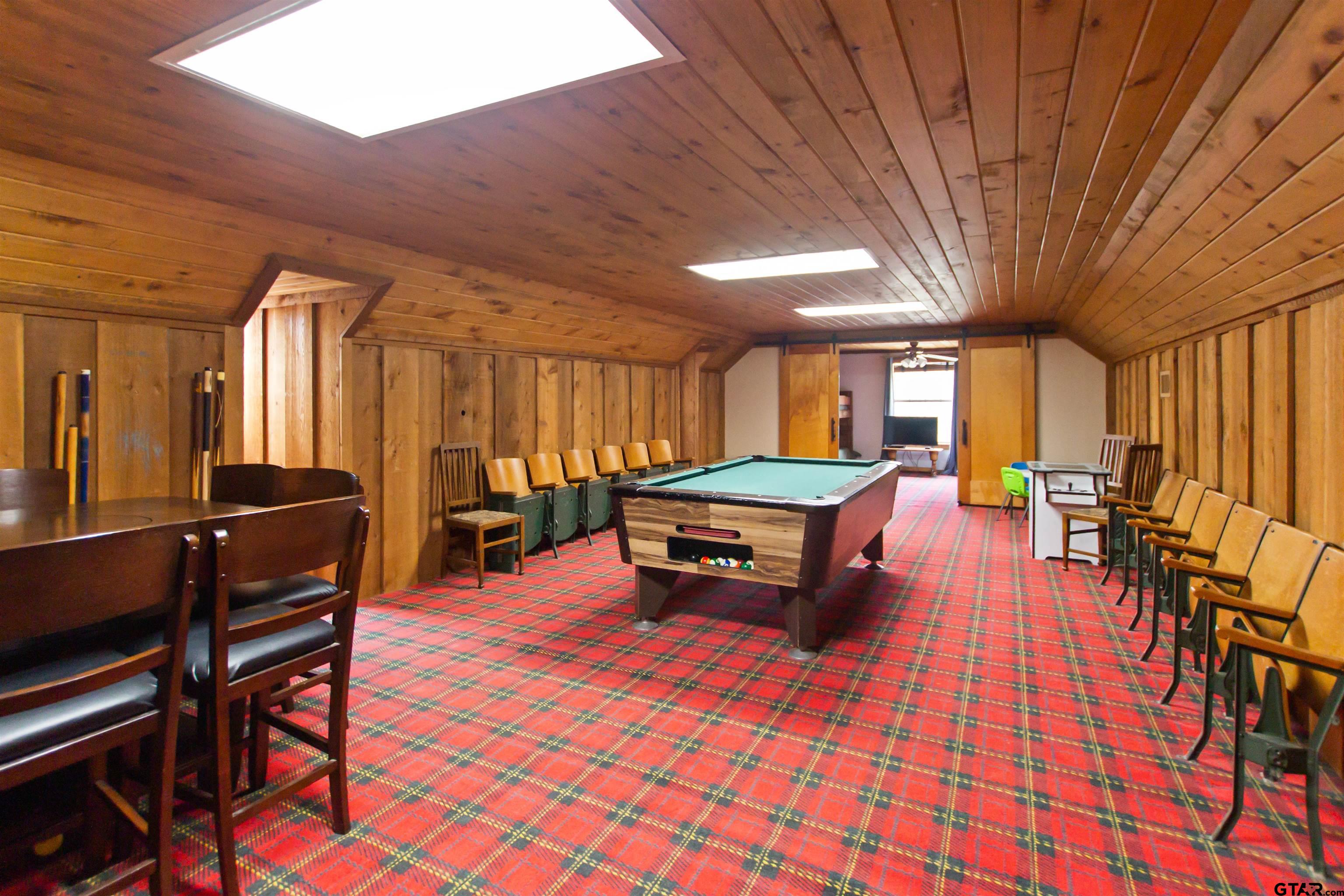 782 Rosie Wady Road Gladewater, TX 75647 - Photo 21 of 41 a room with furniture and wooden walls