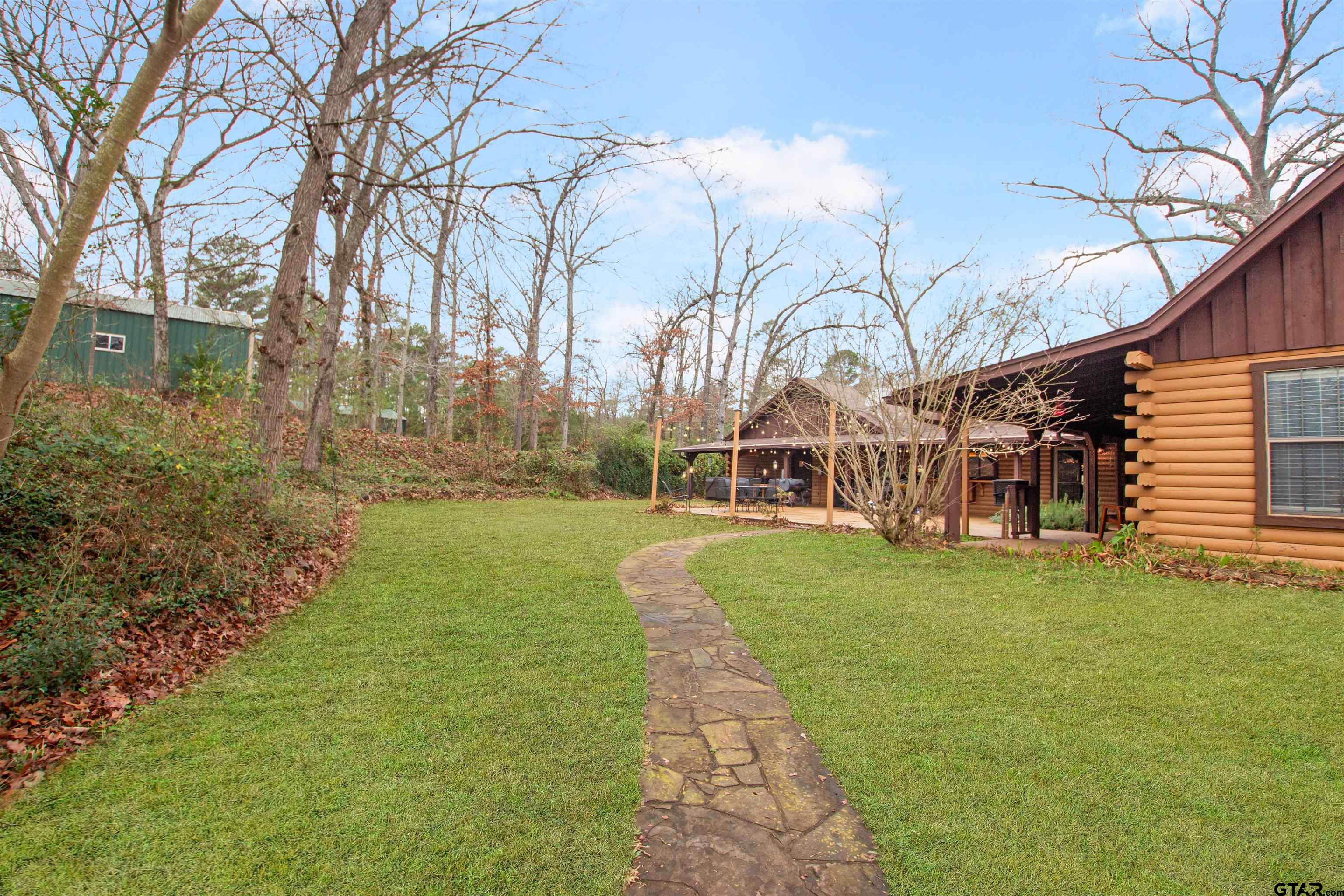 782 Rosie Wady Road Gladewater, TX 75647 - Photo 26 of 41 a view of a house with a yard