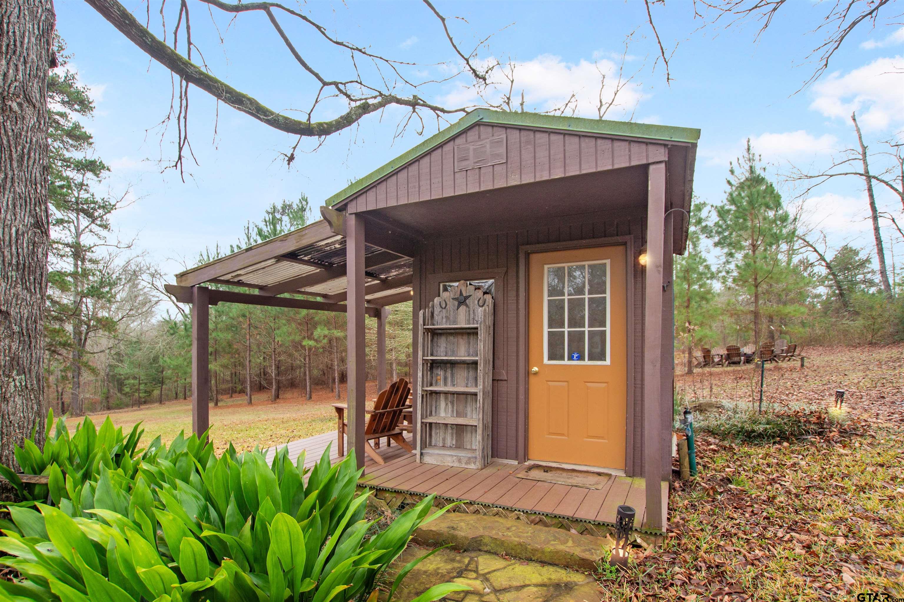 782 Rosie Wady Road Gladewater, TX 75647 - Photo 28 of 41 a front view of a house with garden