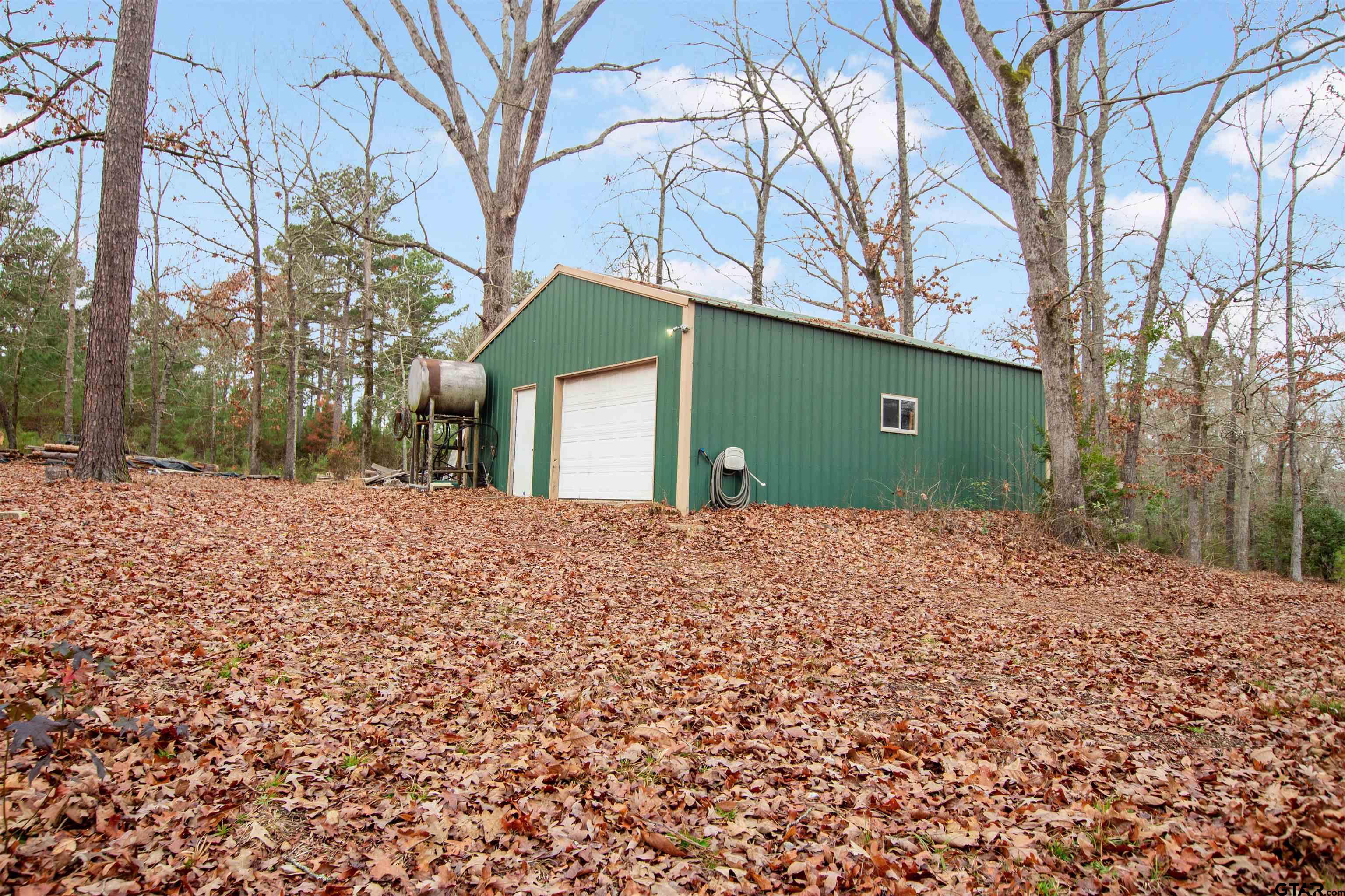 782 Rosie Wady Road Gladewater, TX 75647 - Photo 29 of 41 a view of a house with a snow covered with snow