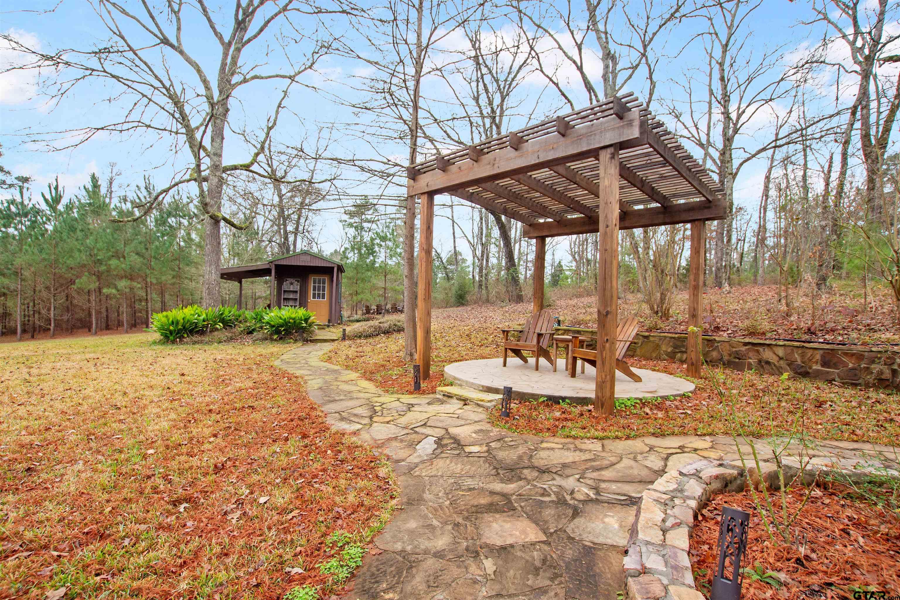 782 Rosie Wady Road Gladewater, TX 75647 - Photo 31 of 41 a view of a house with backyard and sitting area