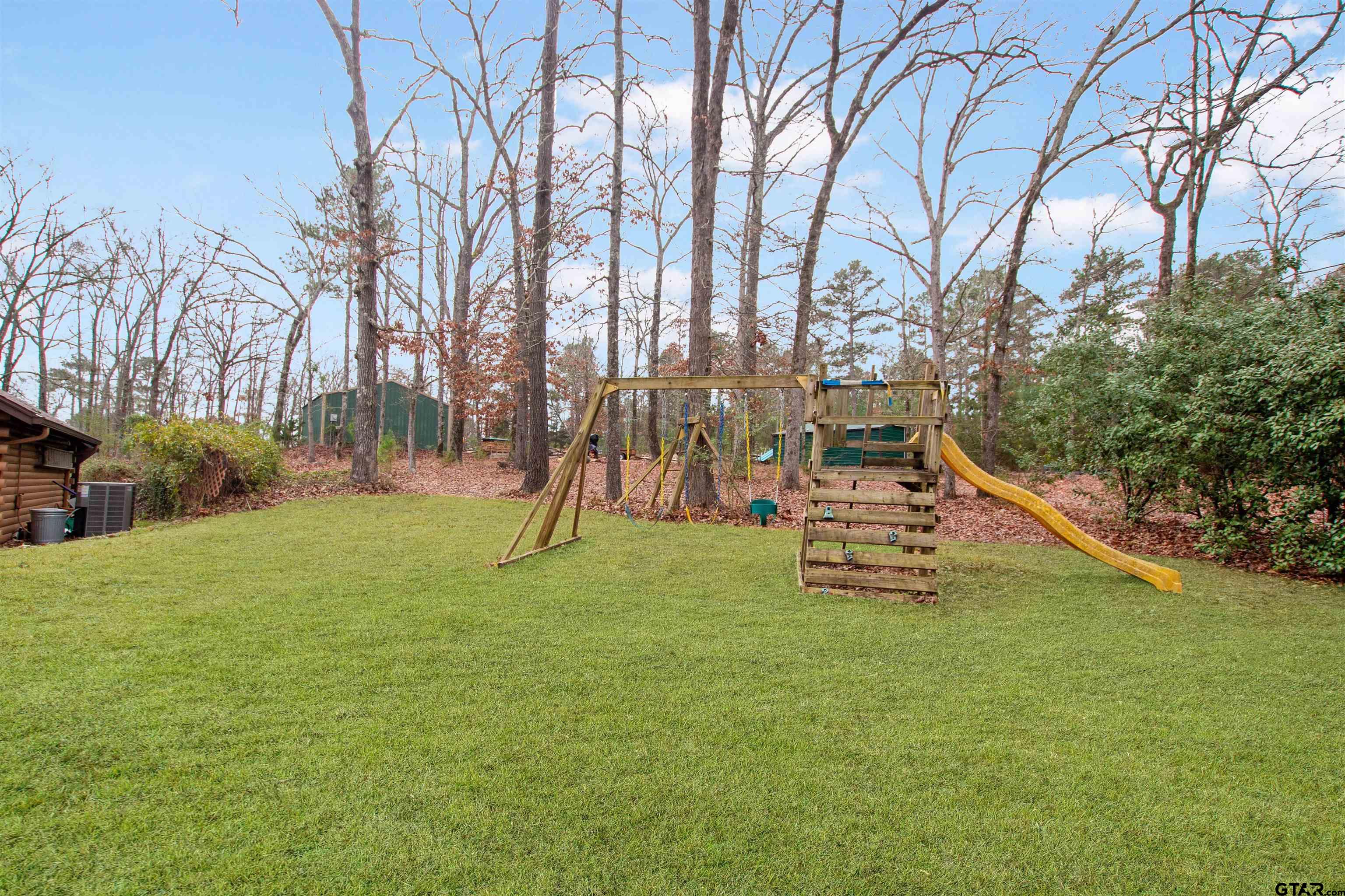 782 Rosie Wady Road Gladewater, TX 75647 - Photo 34 of 41 a view of a park with slide
