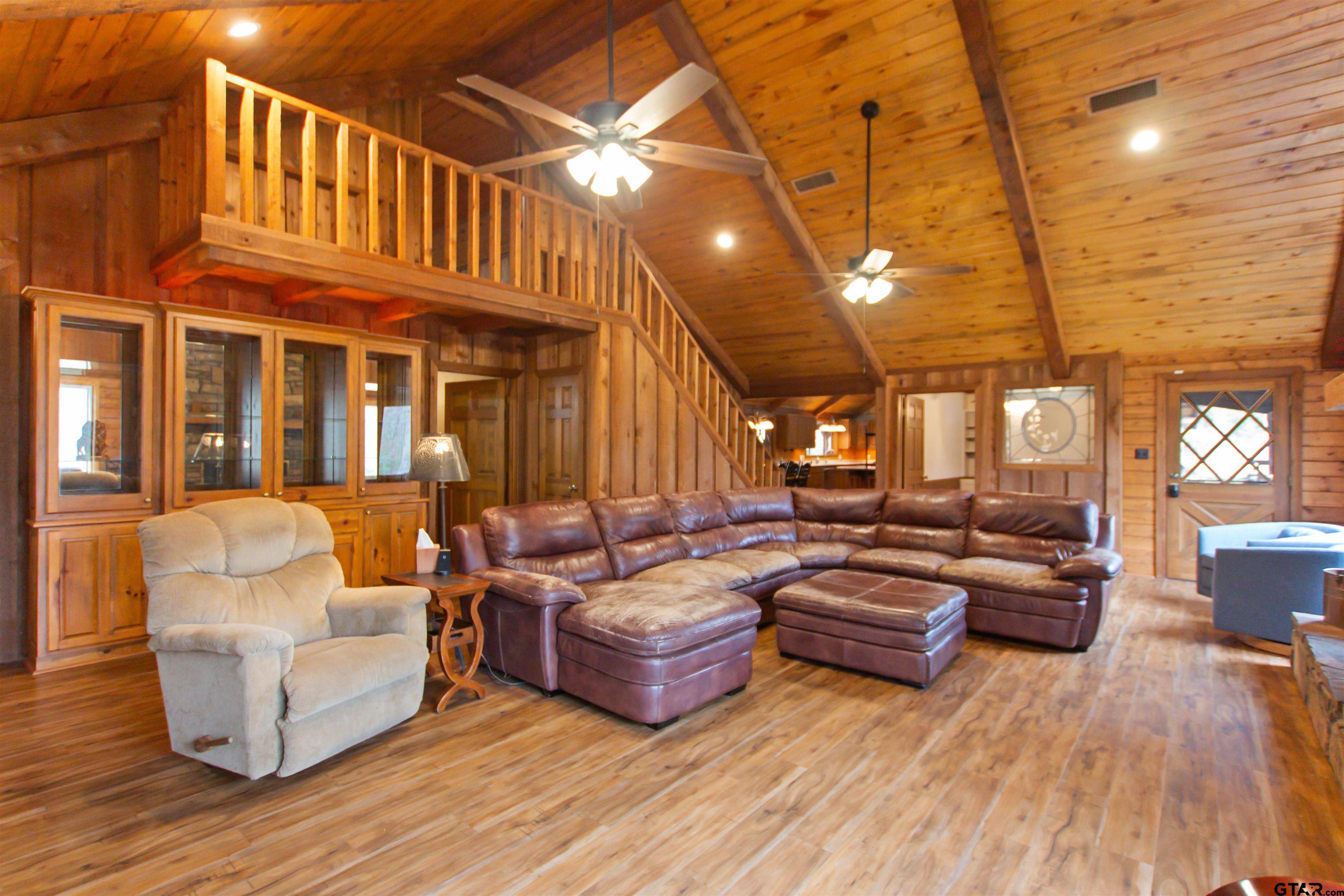 782 Rosie Wady Road Gladewater, TX 75647 - Photo 4 of 41 a outdoor living space with patio furniture and wooden floor