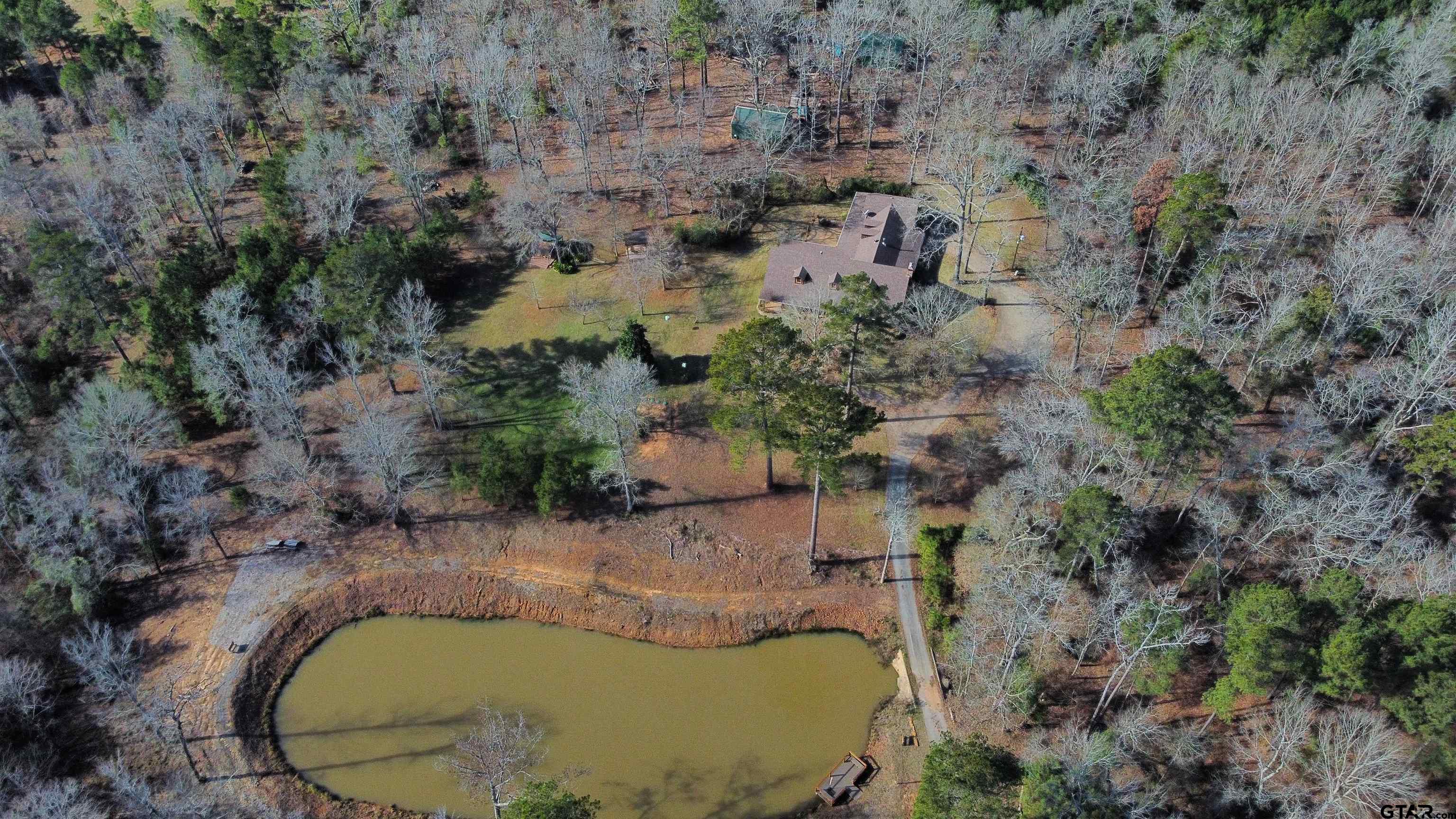 782 Rosie Wady Road Gladewater, TX 75647 - Photo 41 of 41 an aerial view of a house with a yard and trees
